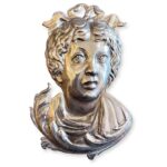 volto in metallo argentato ex voto