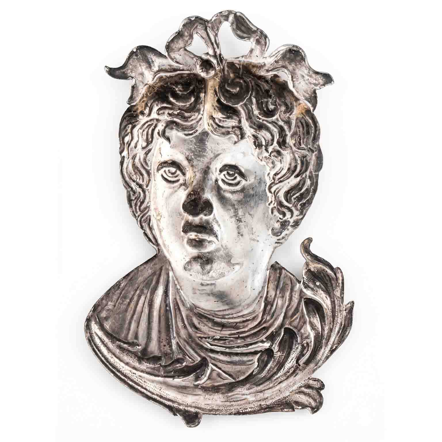 volto in metallo argentato ex voto b